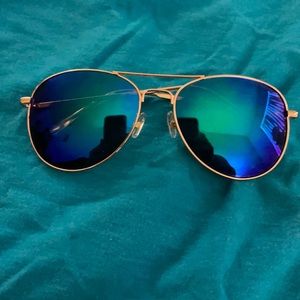 Gold rimmed sun glasses